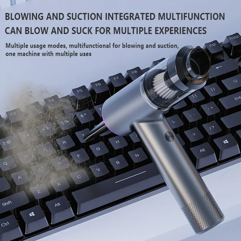 Multifunctional handheld device blowing dust off black computer keyboard with cleaning filter visible